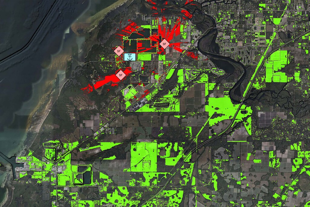 The image shows a map of a coastal area. Enemy line of sight is highlighted in red. Drone launch zone selection is highlighted in green. 