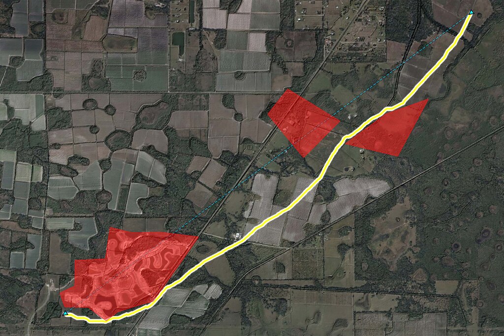 The image shows a map of a landscape. It shows a drone route in yellow, that is calculated to avoid three enemy observation areas that are marked in red. 