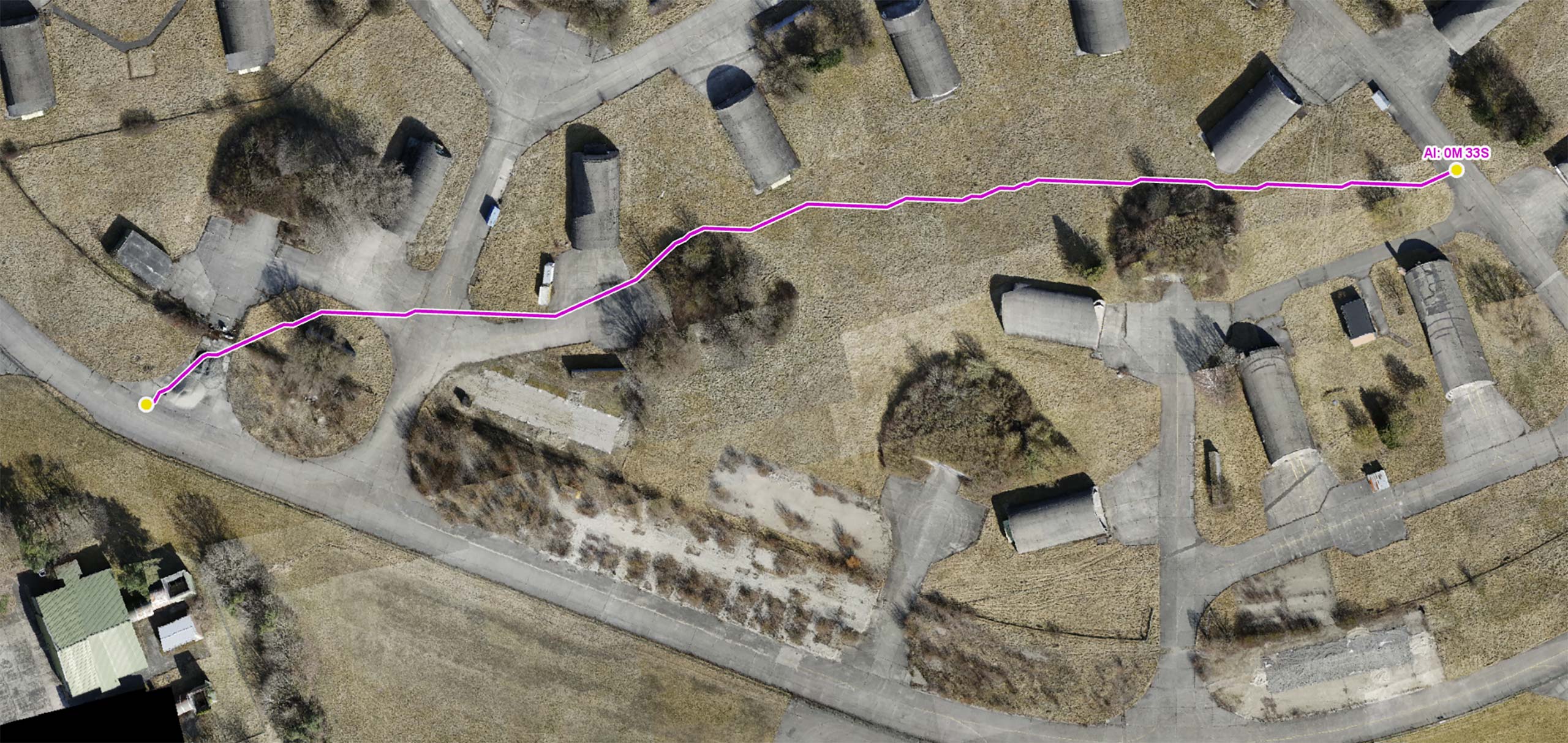 The image shows a route for a UAV. When real-time generated up-to-date, high-resolution data is incorporated into the UAV’s routing scenario, the route avoids traversing obstacles such as trees, and the route is safe and fast.