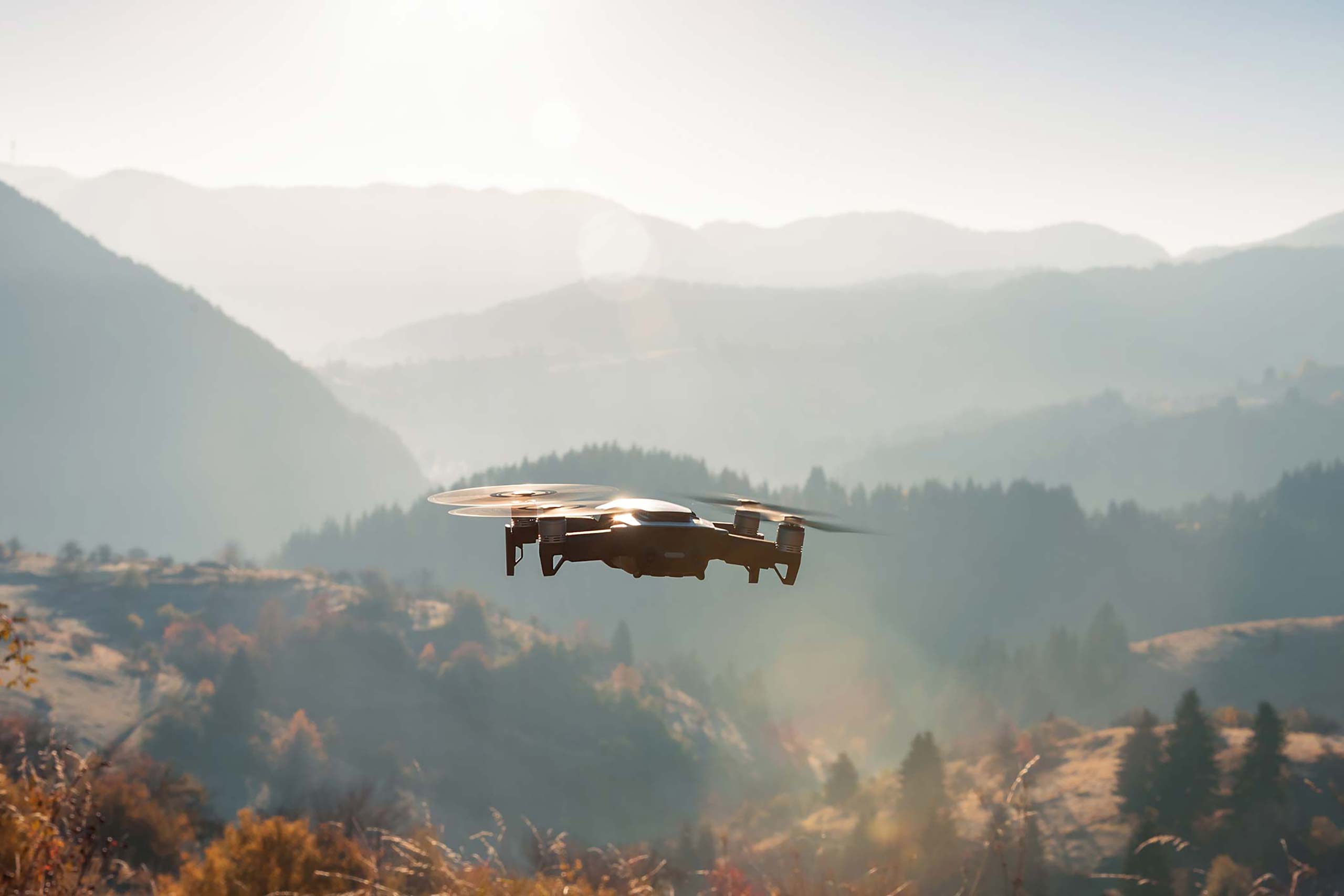 Drone flying above mountains.