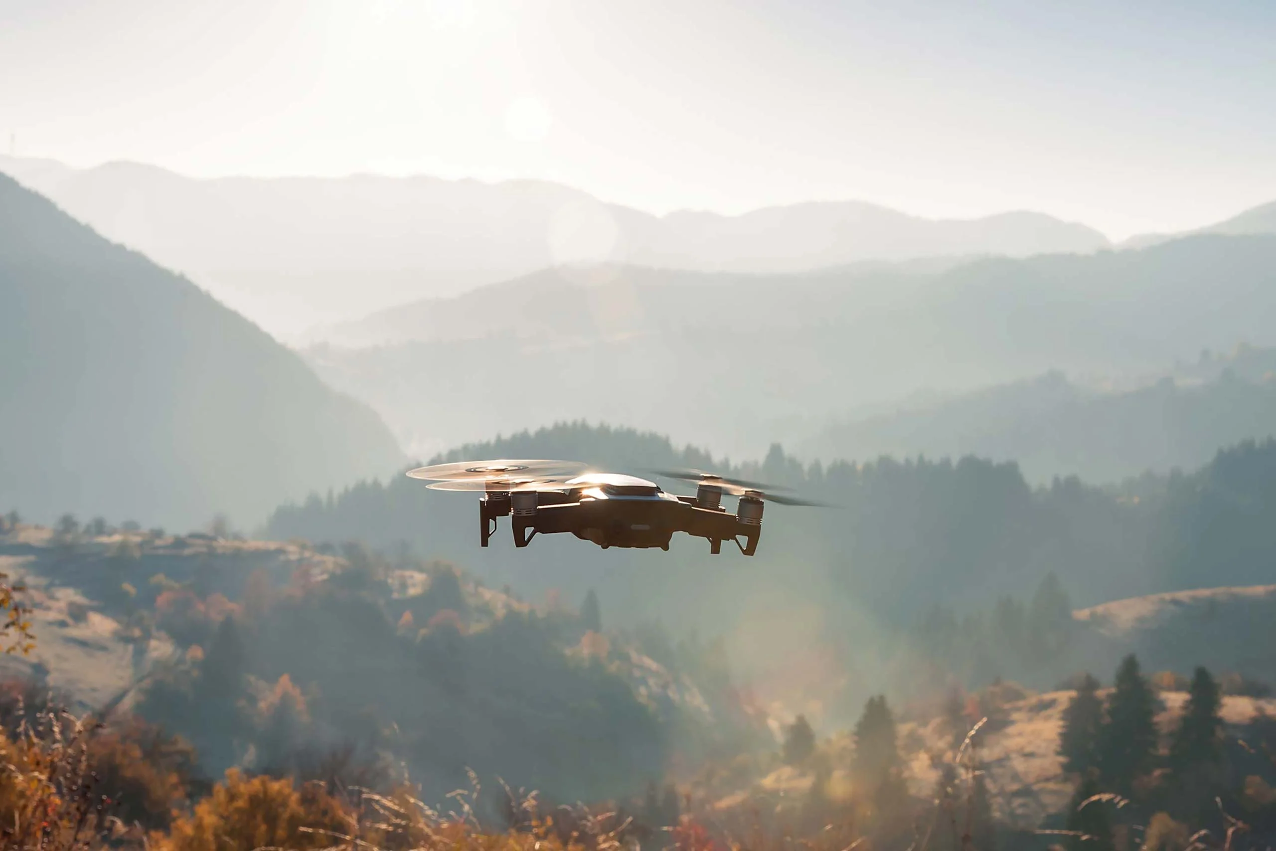Drone flying above mountains.